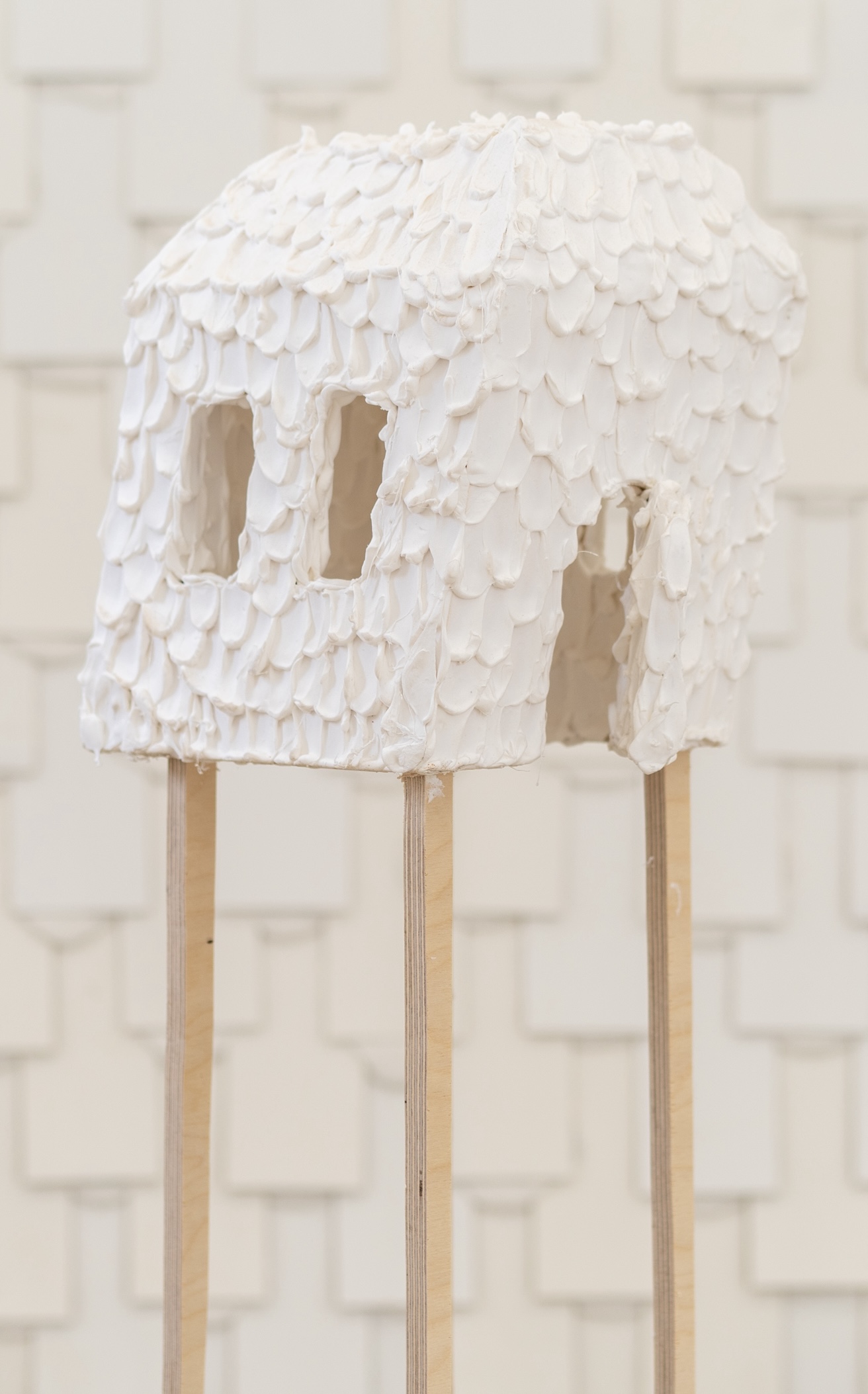 Small House Leaning to its Side, Standing on Four Legs